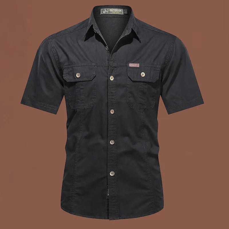 Men's loose fit cotton work shirt in army green with short sleeves and button front.