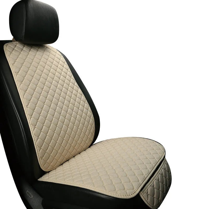 Linen universal car seat cushion with backrest in warm cream colour on a car seat.