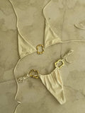 Women's solid colour halter bikini set with lace-up front detail and low-waist briefs.