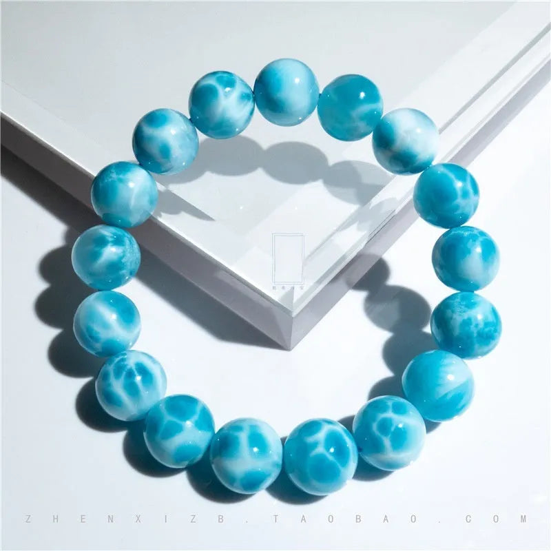 Blue bodhi bracelet with natural sea-pattern crystal stones and pearl accents in Maillard style