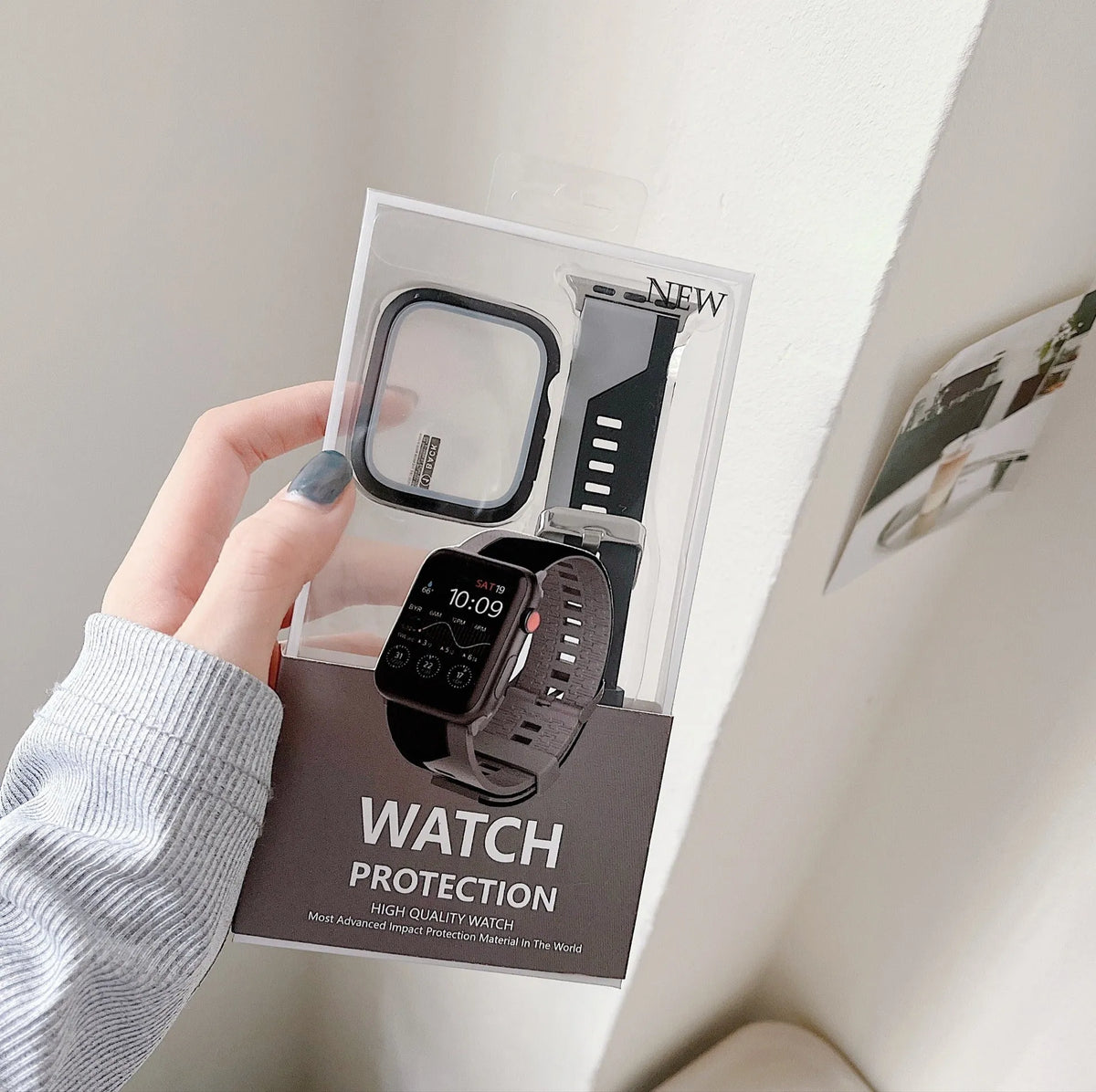 Two-tone silicone protective case for Apple Watch in black and white, fitted on a watch face