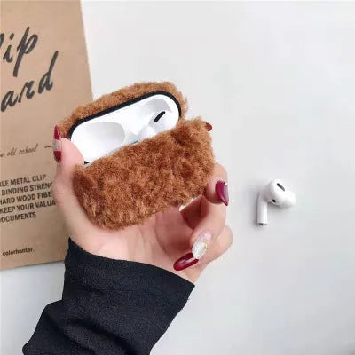 Simple Lamb hard plastic AirPods cover with plush interior in blue, shown next to brown and grey options.