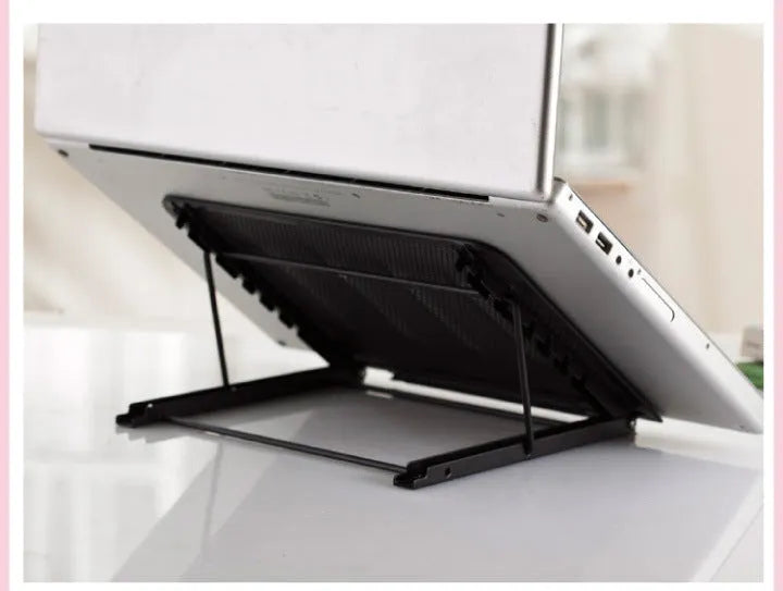 Adjustable steel laptop stand in silver, folded flat, showing spray-coated finish and gear mechanism.