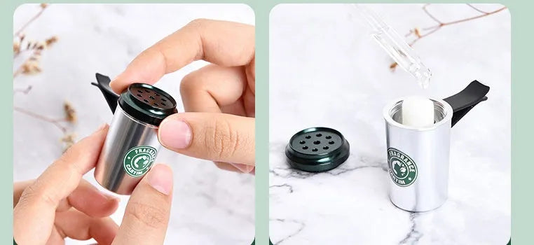 Silver alloy coffee cup shaped solid Gulong perfume seat with natural plant extract on a flat surface