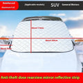 Large aluminium foil winter car cover for SUVs with reflective stripes and magnets on a vehicle windshield.