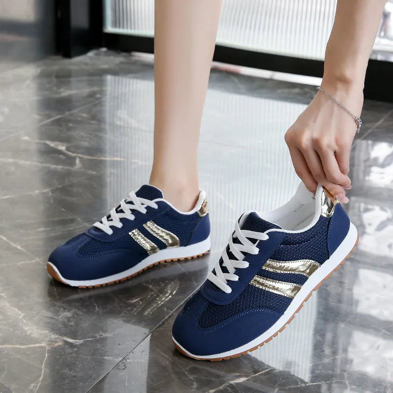 Blue women's casual tennis shoes with cross straps and non-slip rubber sole
