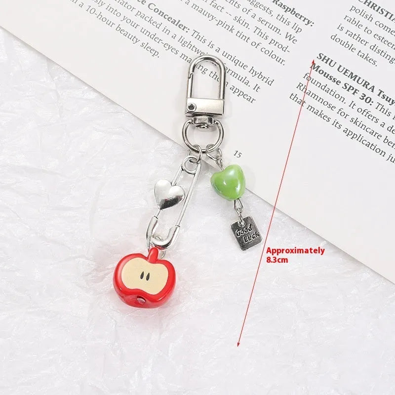 Fruit mobile phone charm keychain with apple, strawberry designs on plastic/resin with rope attachment
