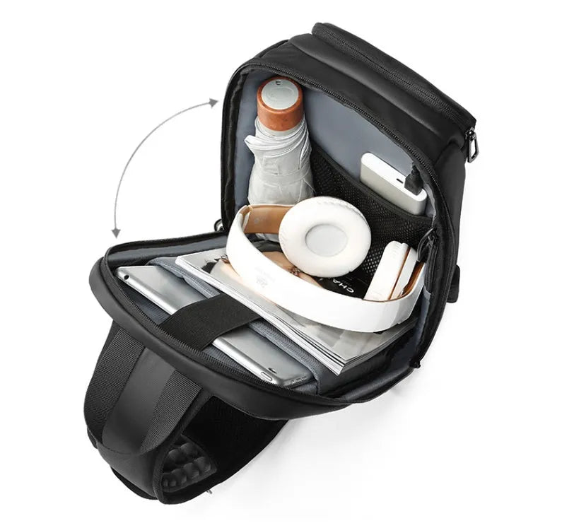 Black PVC medium-sized shoulder bag with air cushion strap and soft handle.