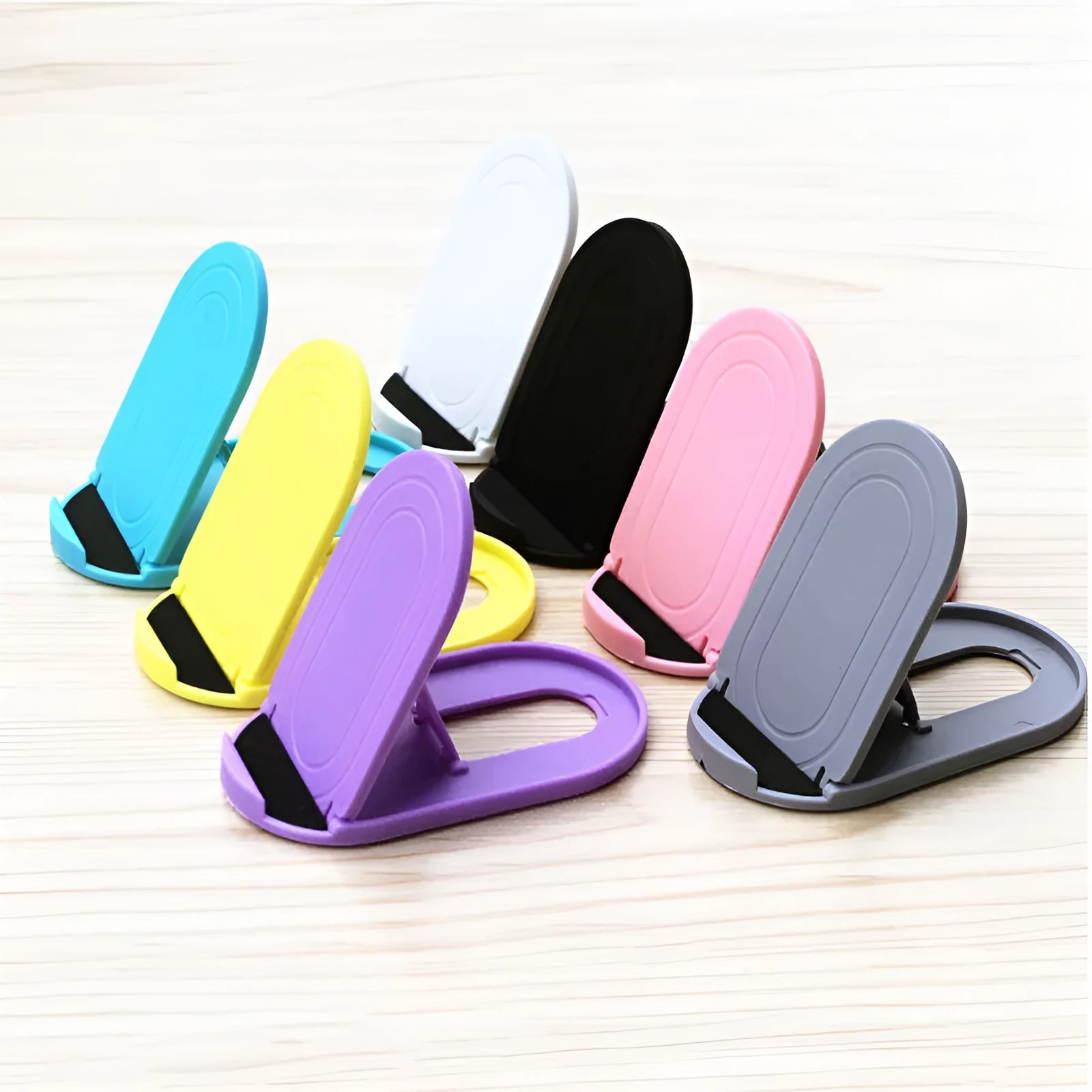 Plastic Lazy Bracket adjustable mobile phone stand in six colour options.