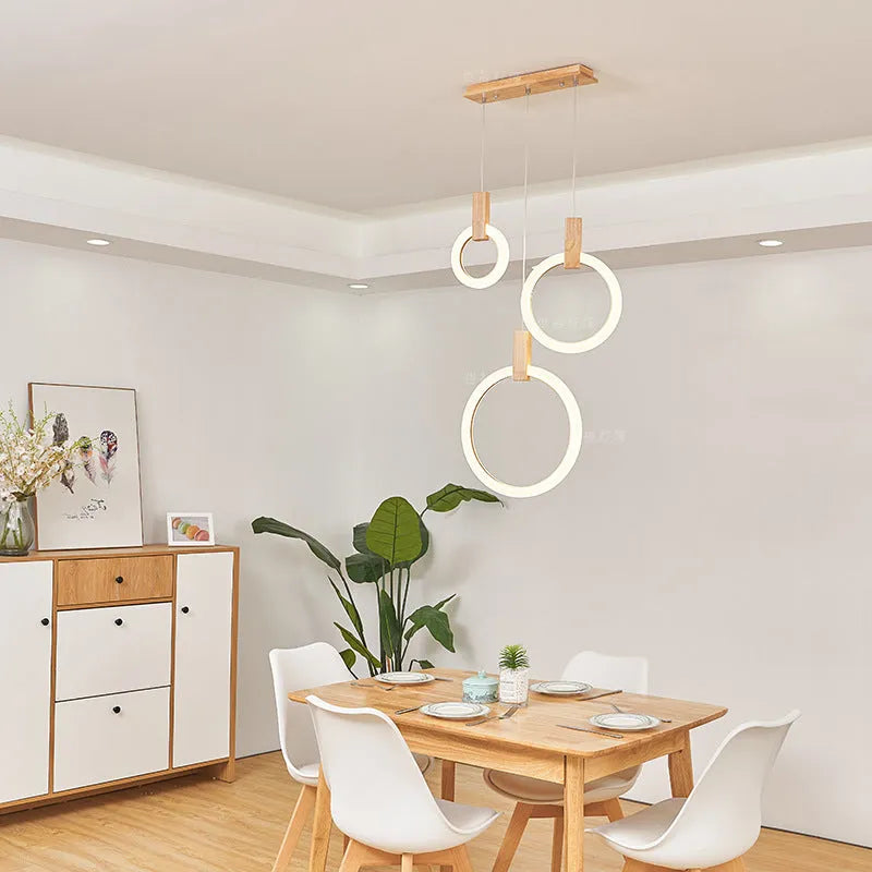 White wooden LED chandelier with three ring sizes 200 300 and 400mm on fishing line suspension for living room