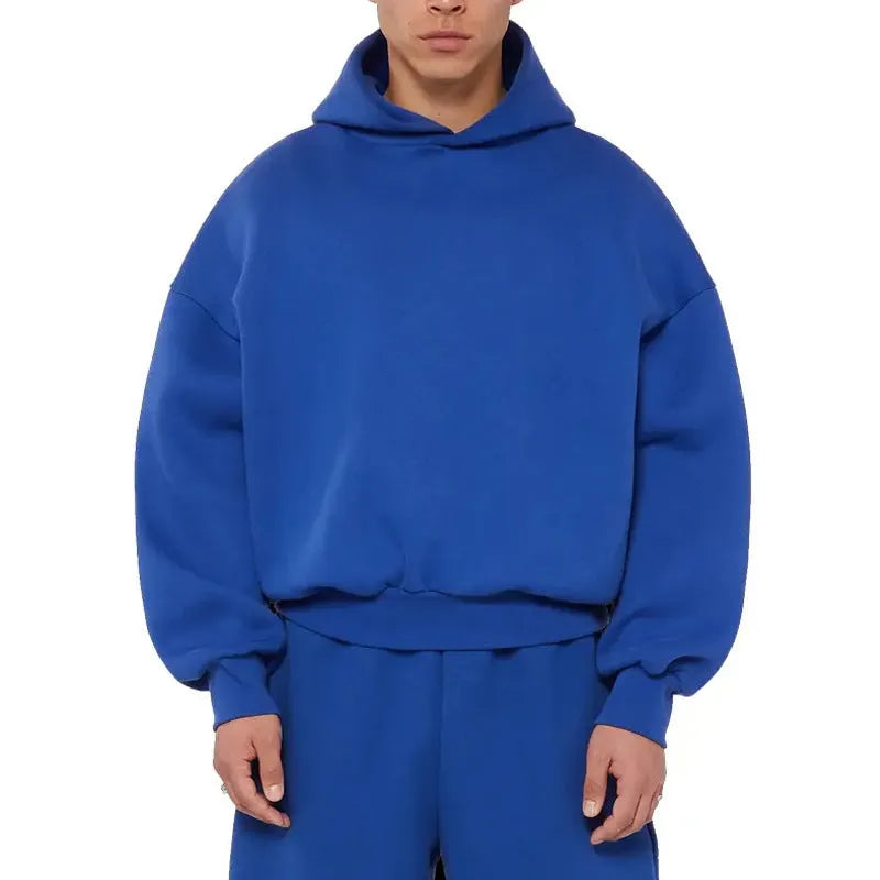 Man wearing a solid colour fleece-lined cotton pullover sweater with a wool lining.