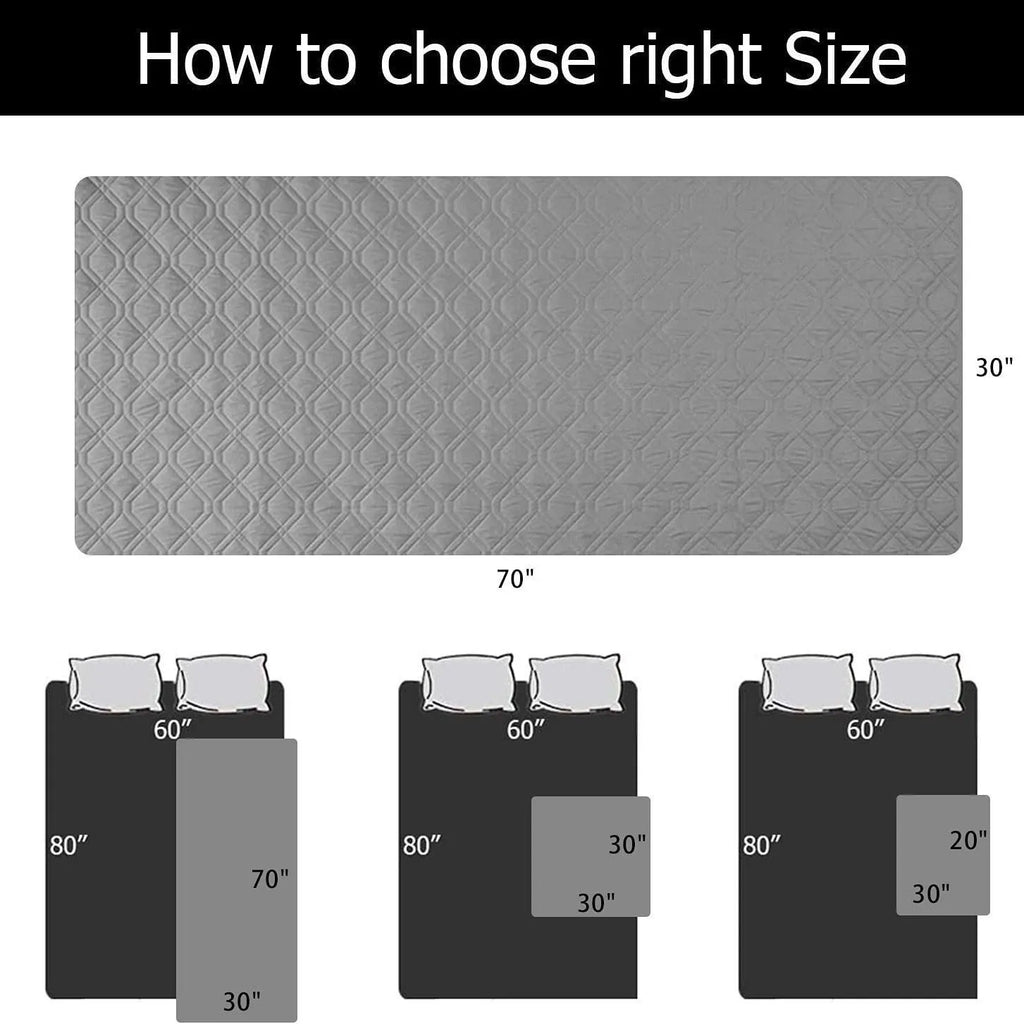 Reversible dog blanket on a sofa, showing two colour options, protecting furniture from pets.