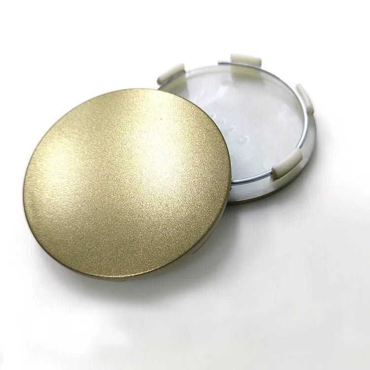 65mm diameter ABS plastic car hub centre cover in antique copper finish with aluminium label.