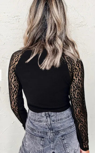 Black leopard print mesh stitching knitted long-sleeved top for women, front view