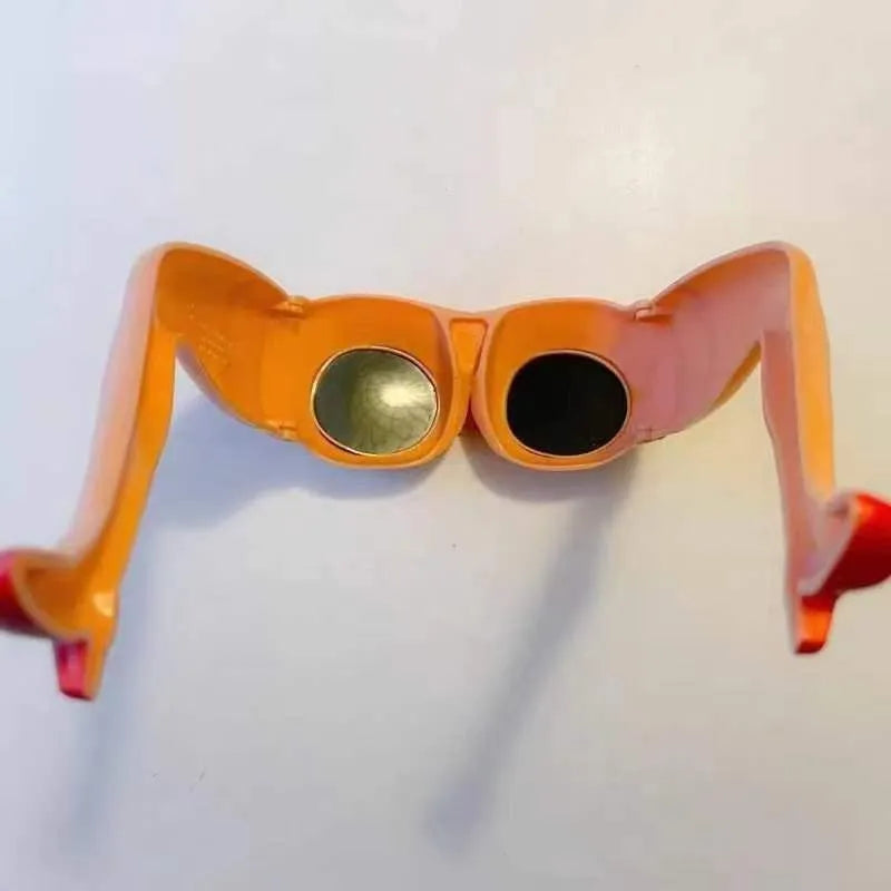 Orange plastic novelty sunglasses with personality leg hip design, dimensions 15x20cm