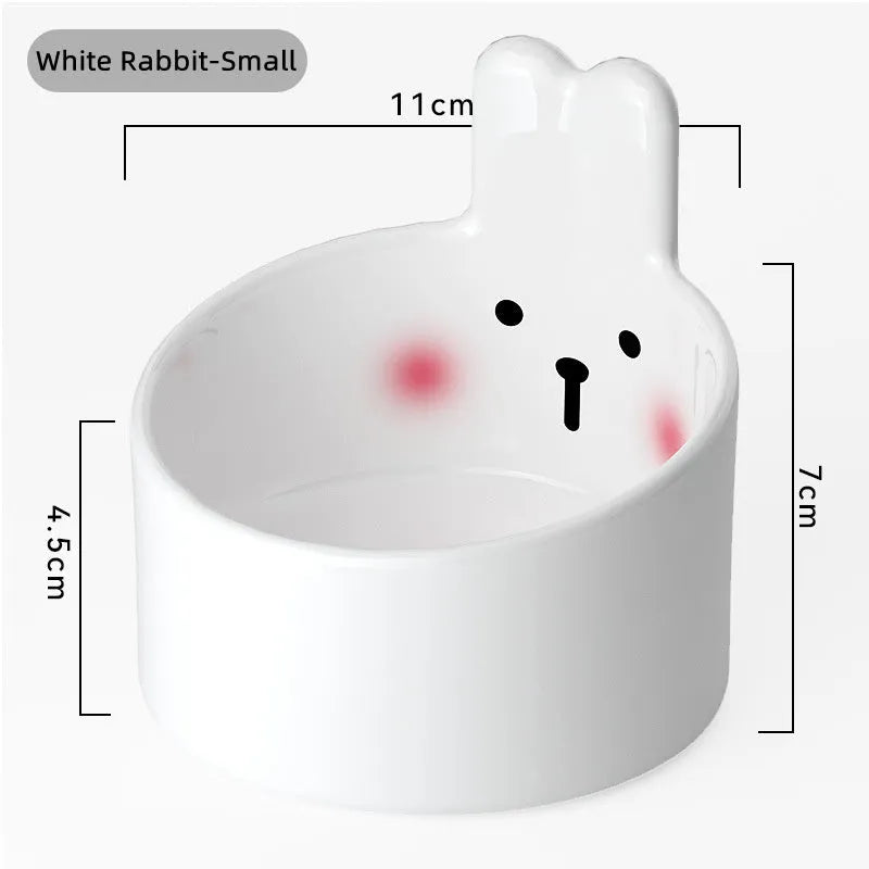 White and yellow ceramic pet feeding bowls with animal patterns in large and small sizes
