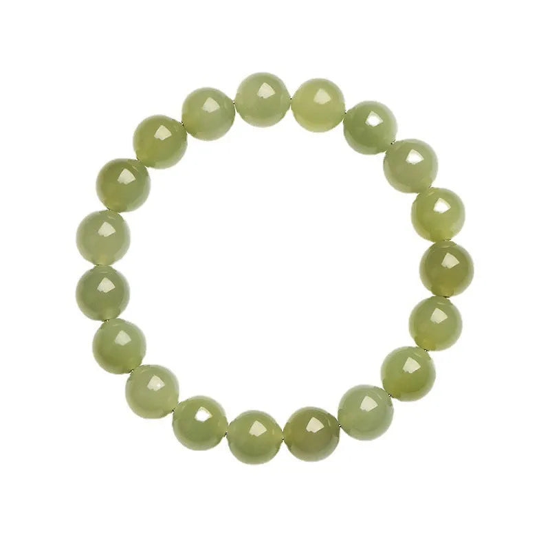 Polished Hetian jade ball bracelet showing ice-clear beads on a wrist, demonstrating deep clear water colour.