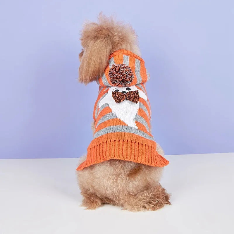 Orange and black striped knitted hooded sweater for dogs or cats with fur ball details.