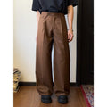 Men's brown straight-leg wide-leg casual trousers showing drape and fit