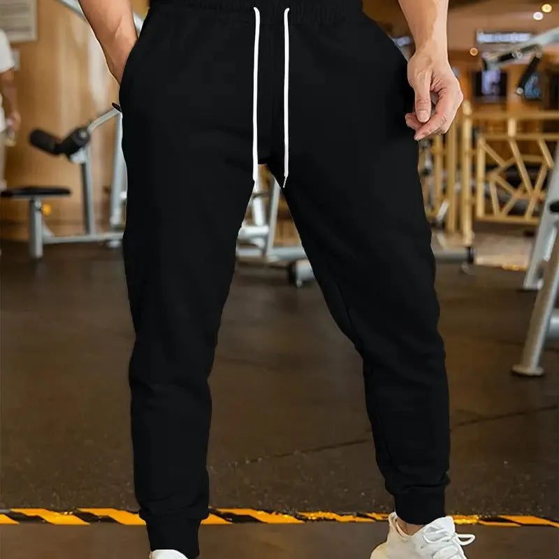 Men's grey linen-style leisure trousers with elastic drawstring waist and loose fit