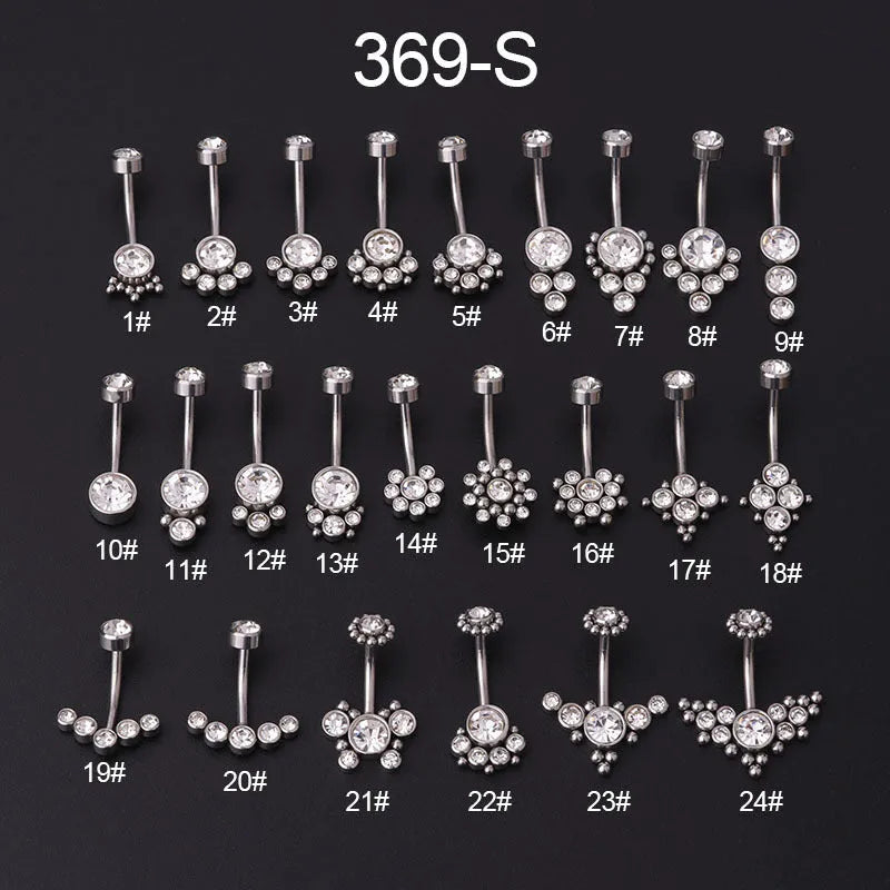 Gold stainless steel belly button ring with clear artificial gemstone inlay on white background