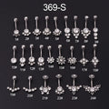 Gold stainless steel belly button ring with clear artificial gemstone inlay on white background