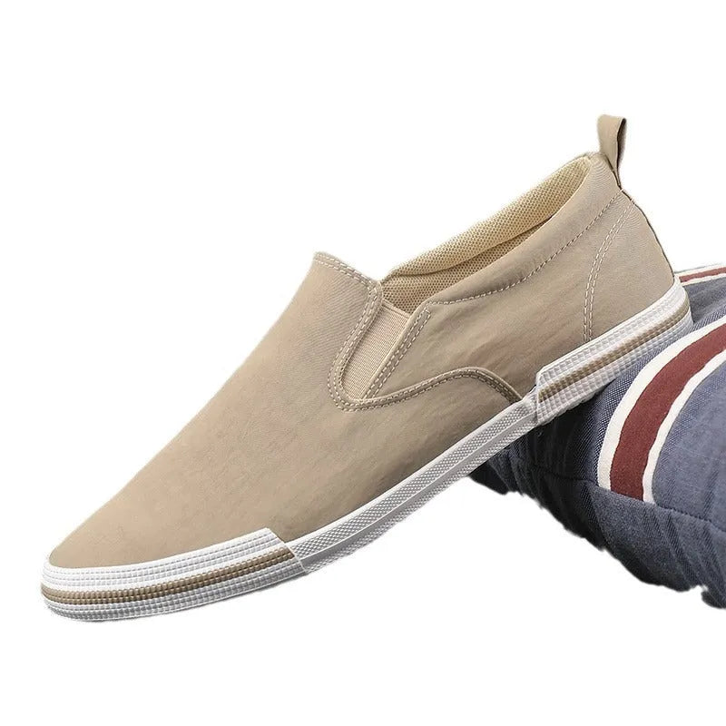 Men's low-top casual canvas shoes in grey, black orange, or khaki with vulcanised rubber soles.