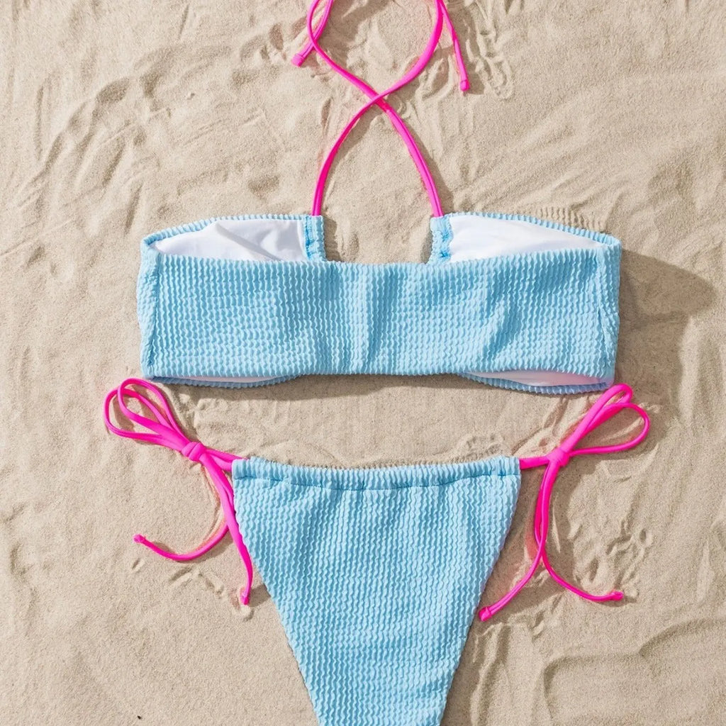 Solid colour women's halter neck lace-up bikini set with backless design on a mannequin