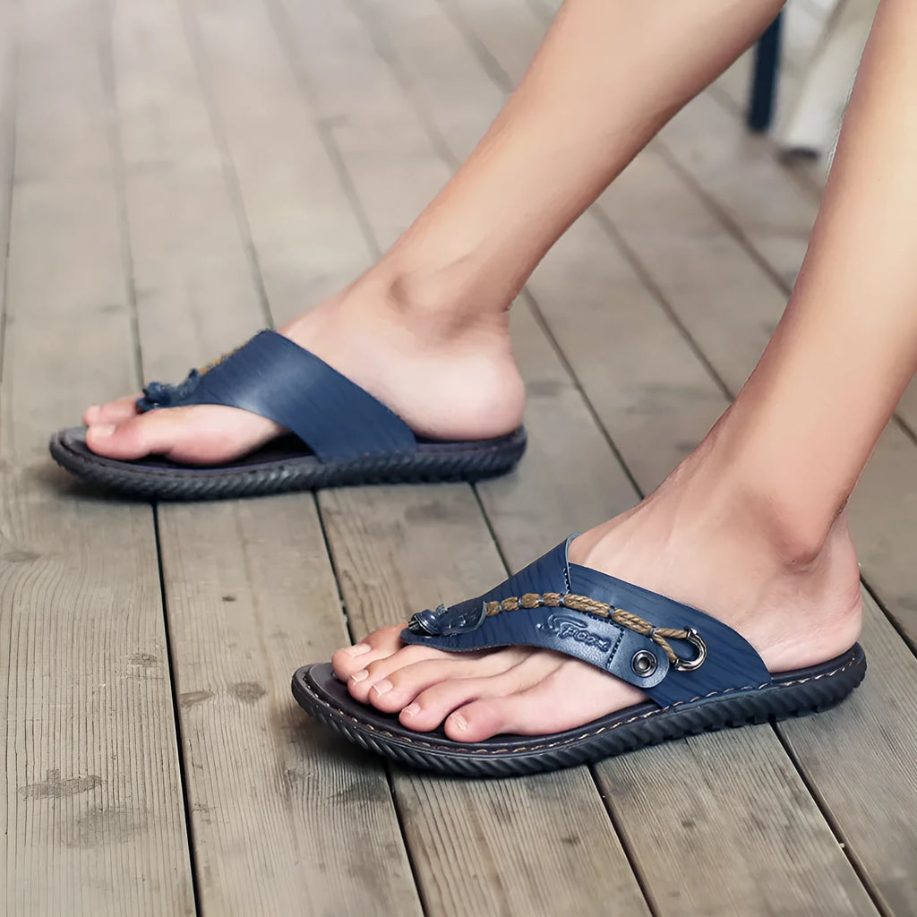 Men's black casual PU leather slippers with non-slip sole, shown from the side.