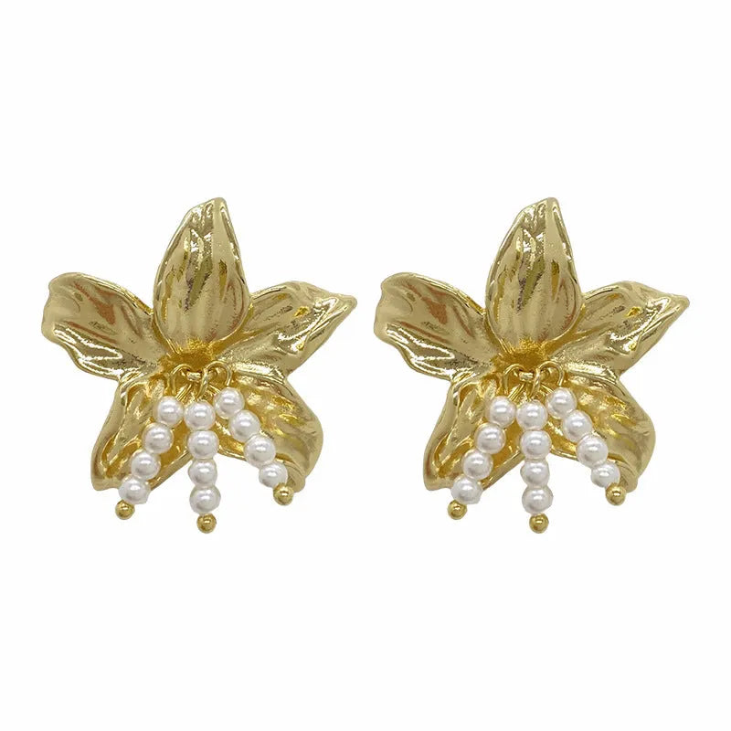 Exaggerated gold H1795 pearl flower earrings with Seiko crystal treatment, showing floral design.