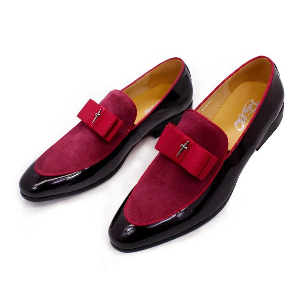 Men's glossy patent leather dress shoes with tassel detail in black, showing low-top design and leather toe holder.
