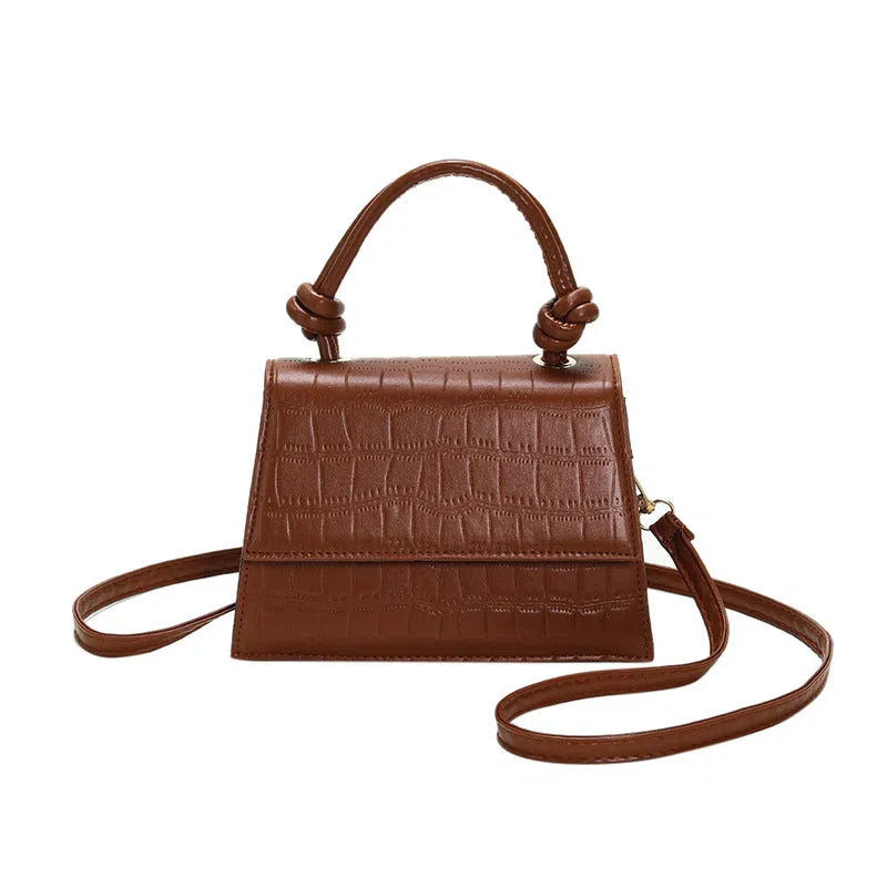 Women's soft PU underarm bag in horizontal rectangle shape with stitched seams and single shoulder strap