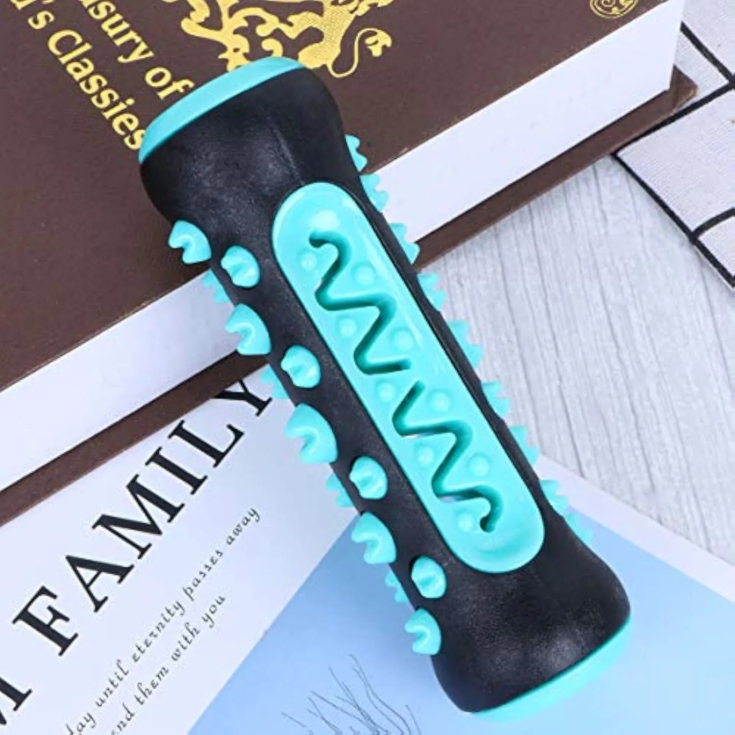 Natural rubber dog dental chew toy in blue, green, yellow, or black blue, showing textured cleaning surfaces.