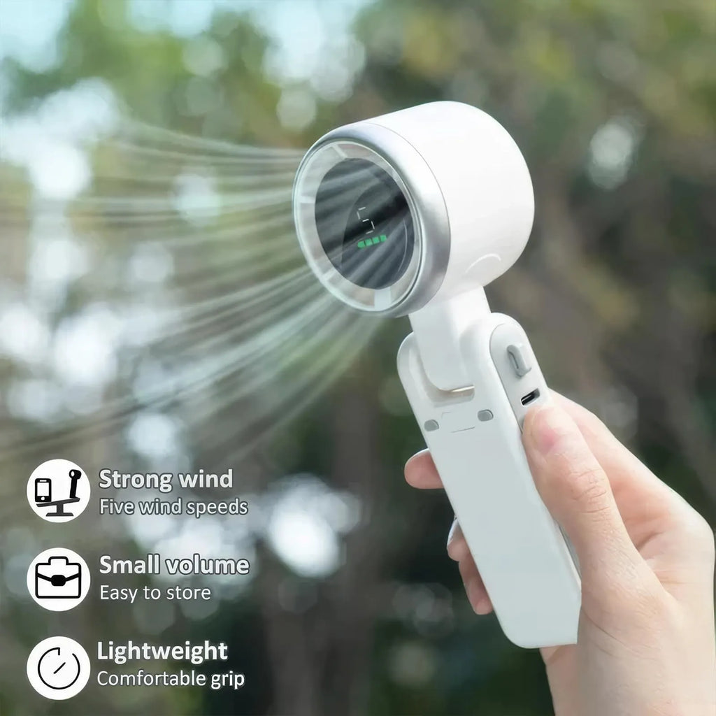 Folding handheld turbo fan in black with 180-degree tilt, compact plastic design
