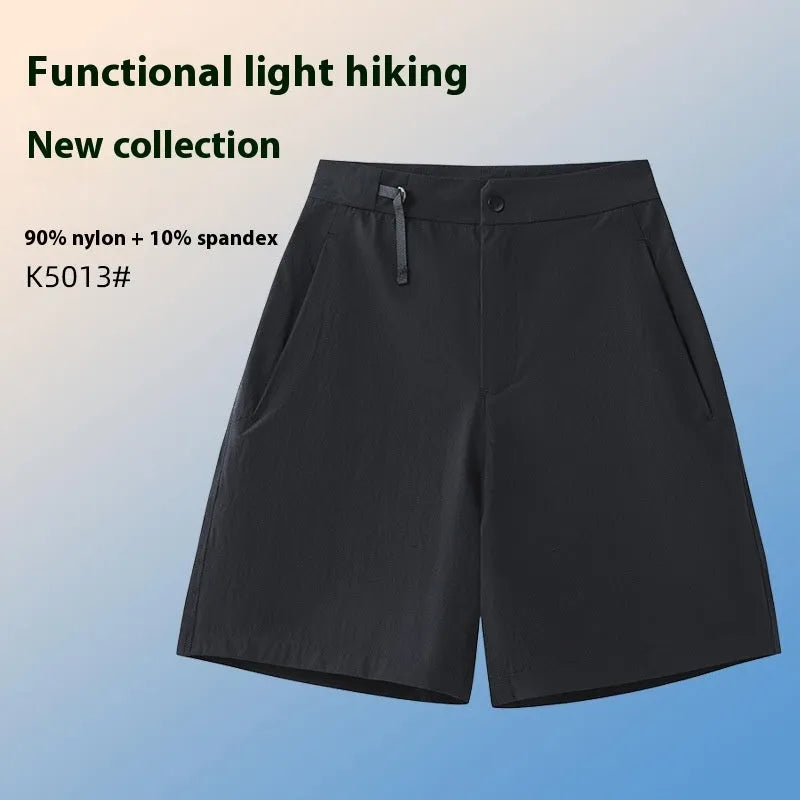 Men's quick-drying sports shorts in a solid colour with elastic waistband and 3D cut leg.