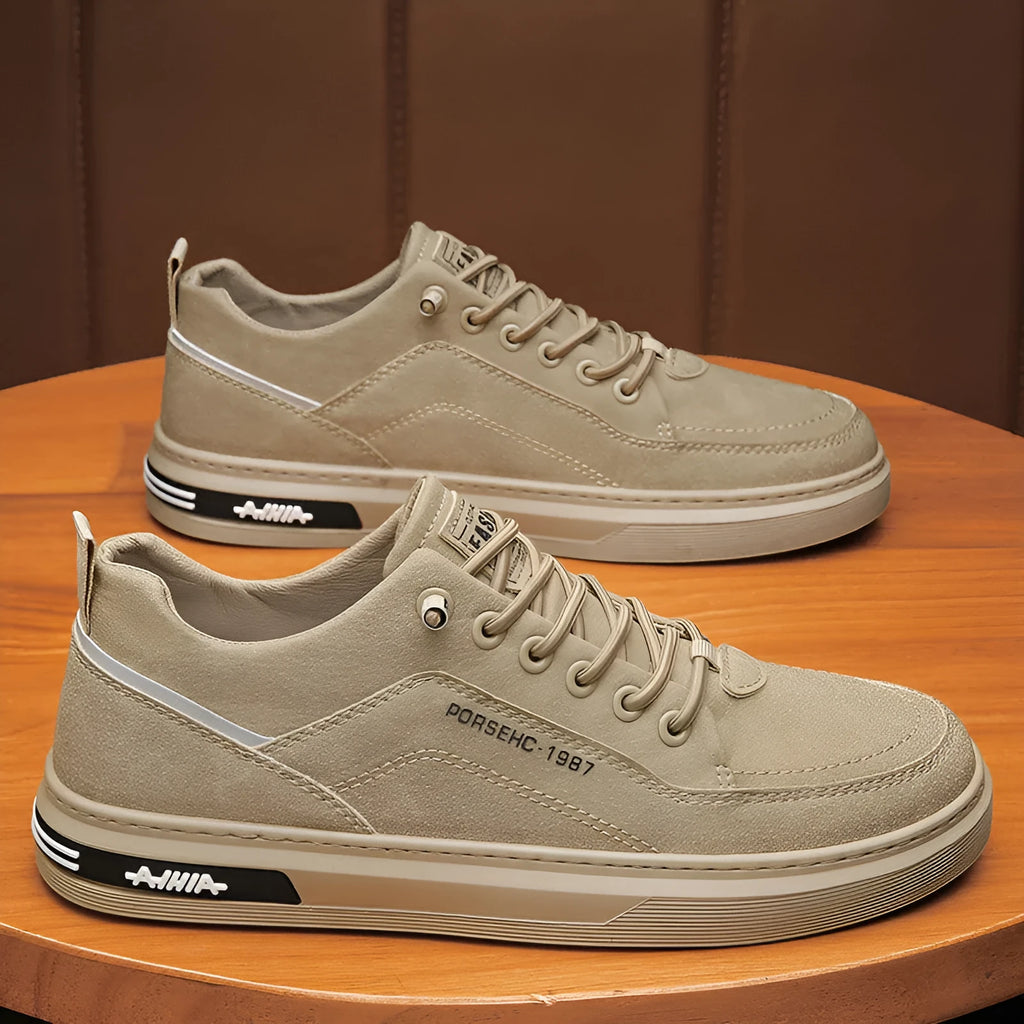 Men's khaki casual work shoe with round toe, low top, and rubber sole on a plain background.
