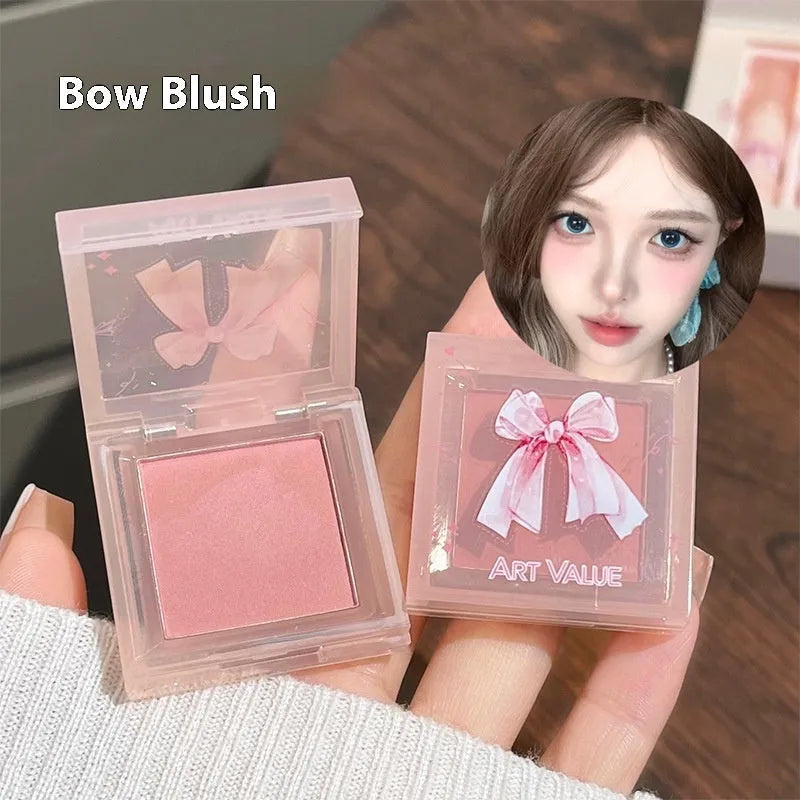Pink butterfly box suite makeup set with lip muds, blusher, and necklace.