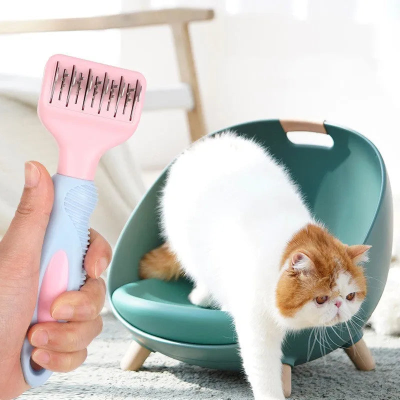Pink dog comb with stainless steel blade and massage nodules for pet grooming.