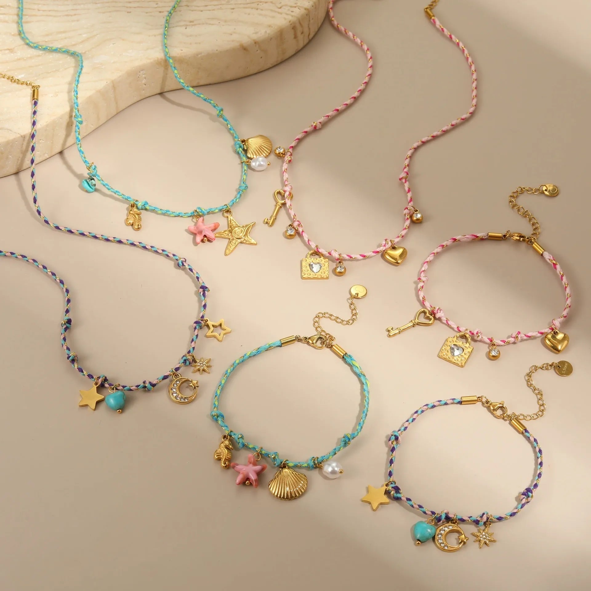 Handmade stainless steel necklace with coloured braided rope detail and geometric pendant