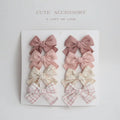 Children's fabric hairclips with dovetail bow design in multiple colour patterns