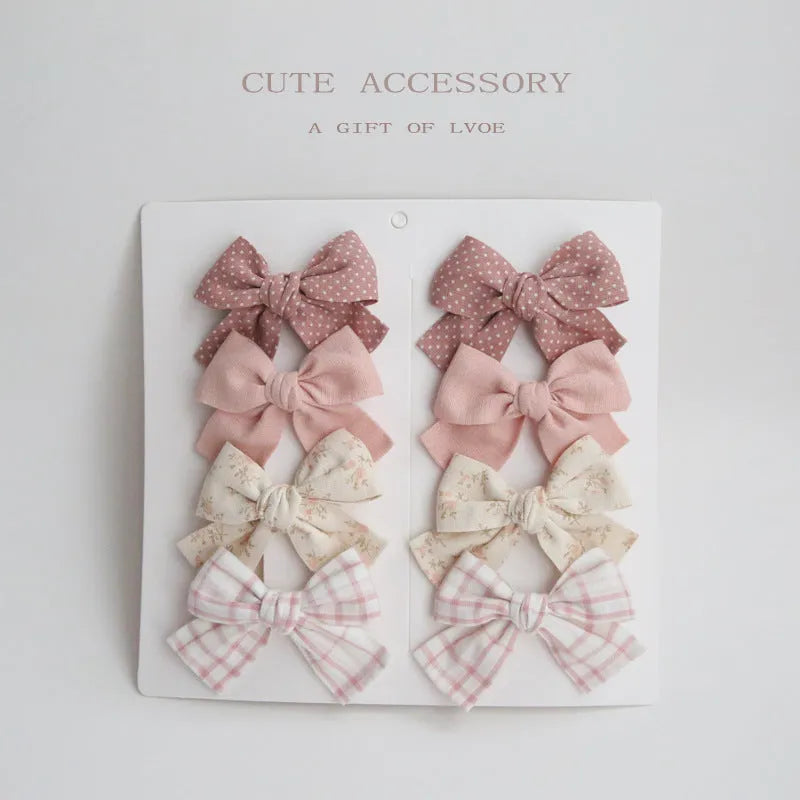 Children's fabric hairclips with dovetail bow design in multiple colour patterns