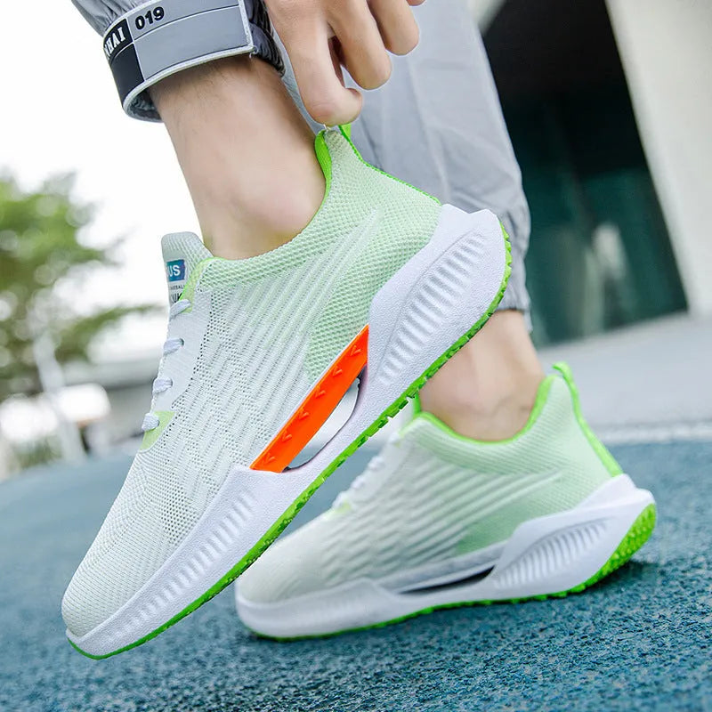 Men's blue casual sports mesh shoes with round toe and cloth upper on a plain background.