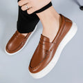 Men's casual slip-on loafers in PU leather with round toe, shown in white, black and white, and khaki colours