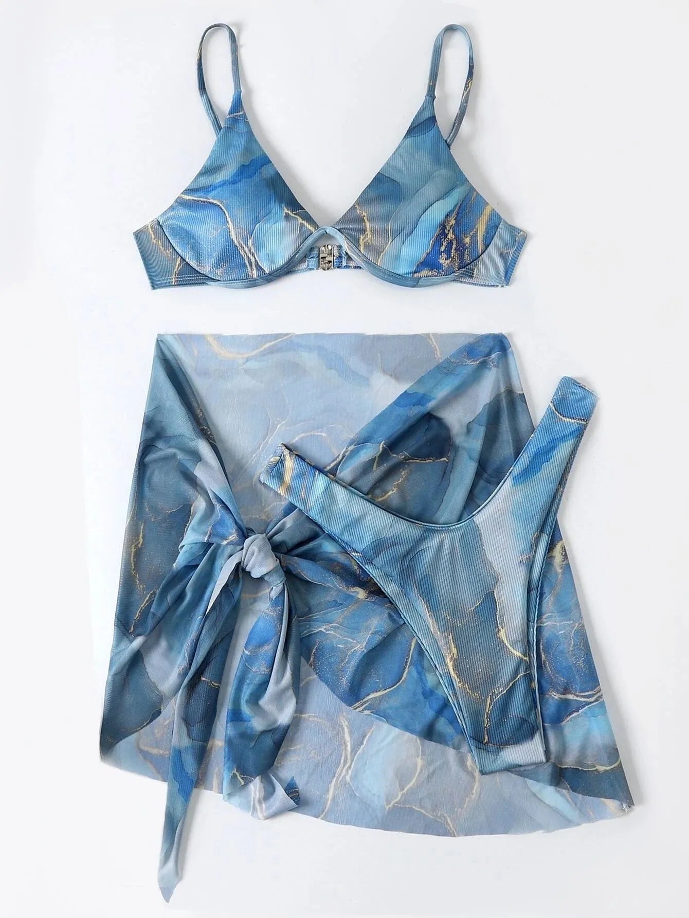 Marble print women's three-piece bikini swimwear set with skirt, bra, and panties on a mannequin.