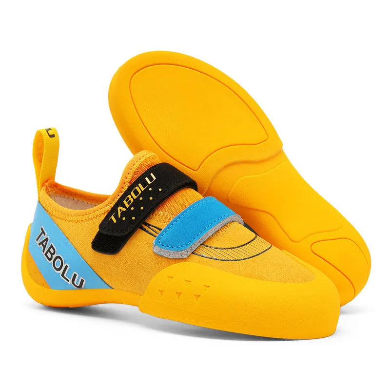 Beginner rock climbing shoes with Velcro straps and non-slip rubber soles in black/red colour