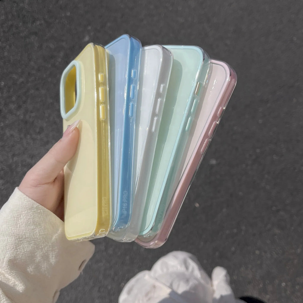 Simple solid colour jelly TPU phone case for iPhone, shown in blue, white and yellow.