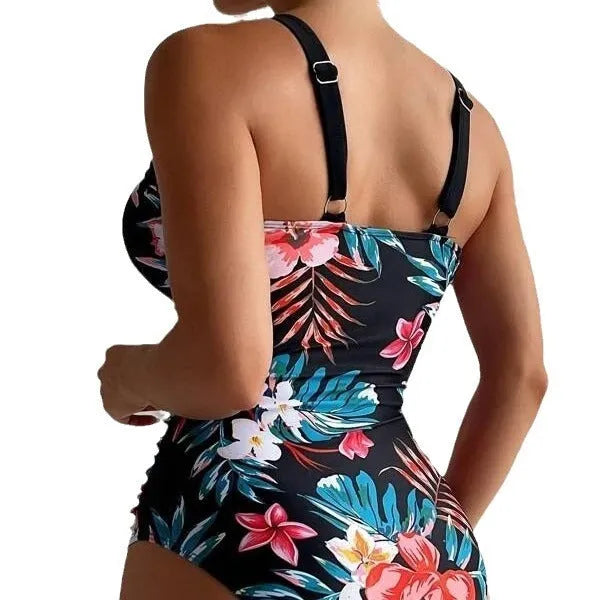 Women's black floral one-piece swimsuit with a backless design.