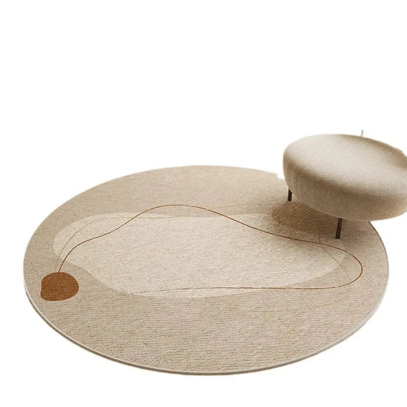 Simple round carpet in modern geometric pattern on floor under desk with swivel chair
