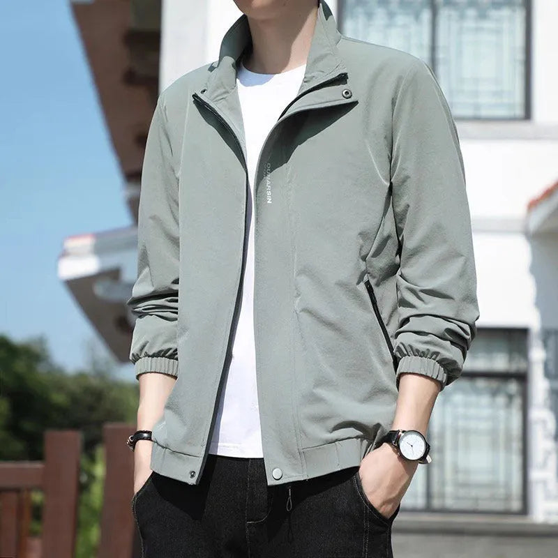 Men's black stand collar casual sports coat made from polyester fabric on a hanger.