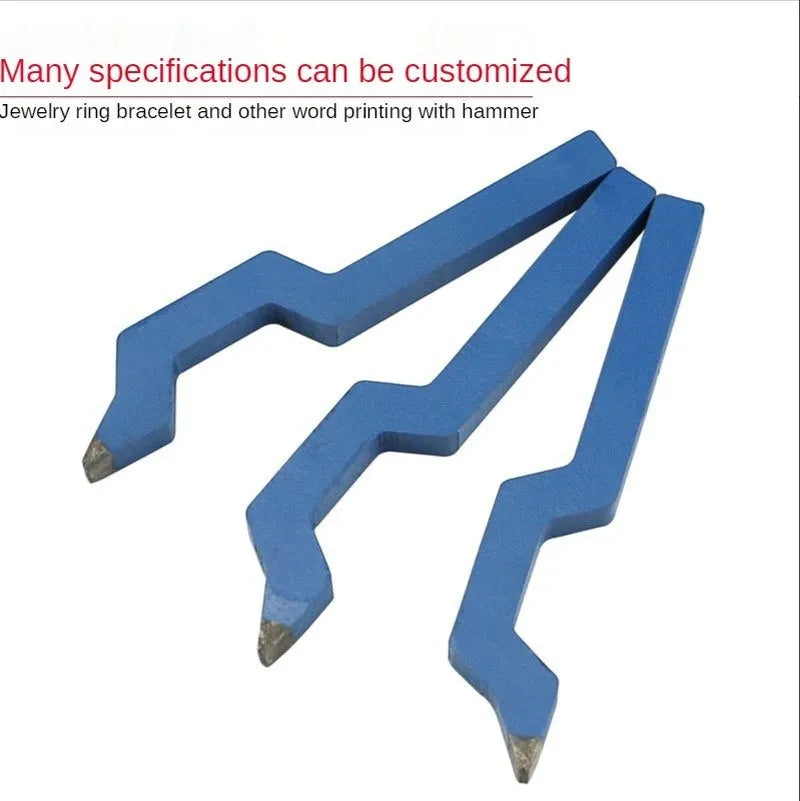 Curved alphanumeric steel stamping tool for jewellery on a metal surface.